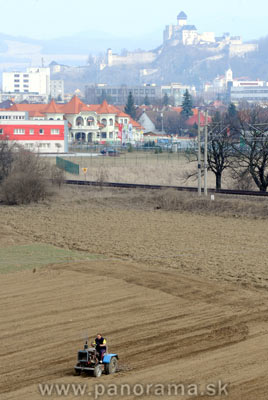 Spring farm work started in Slovakia, near Trencin Castle.