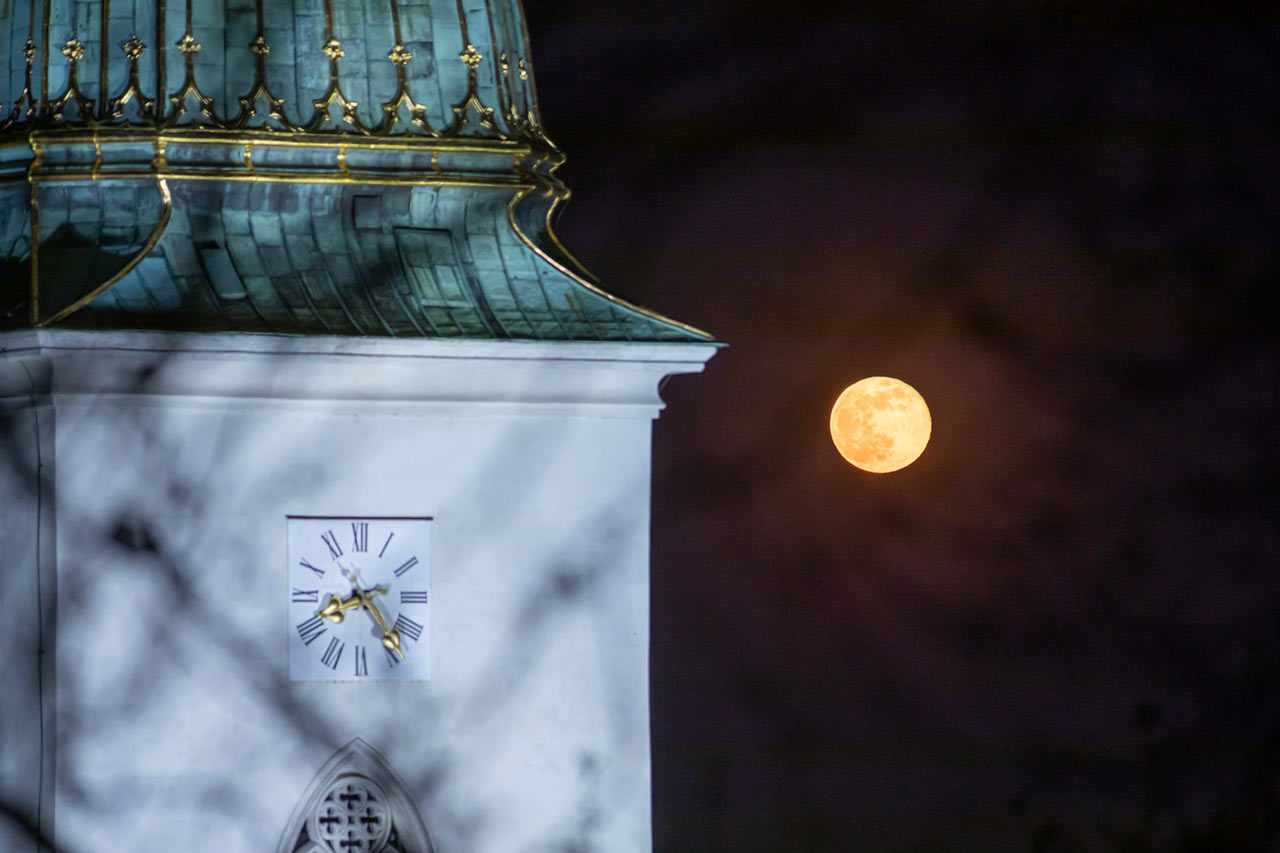 The Moon and the tower of Cathedral of St. Martin in Bratislava